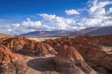 Weathered rock formations at a dark lagoon