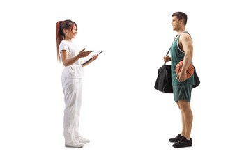 Massage therapist talking to a basketball player