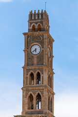 The clock tower in Acre, Akko, Israel on a sunny day
