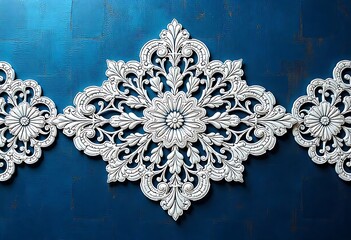 Ornate White Wall Decor on Deep Teal Background