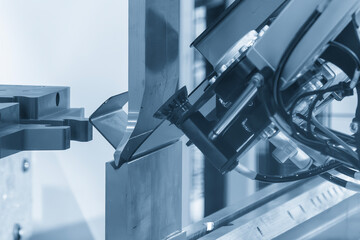 High technology bending machine operation with robotic system in the blue tone scene.
