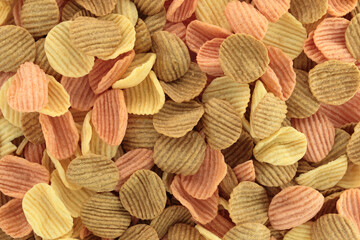 Background made of assorted vegetable chips, full focus stacking for sharp texture, crisp detail...