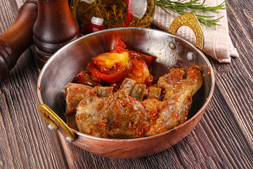 Baked lamb ribs with vegetables