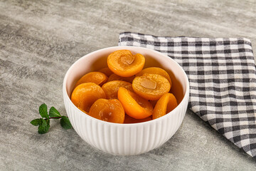 Sweet canned apricots with syrope