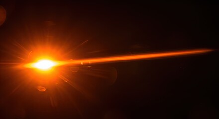 Golden Light Flare Shining Brightly on Black Background