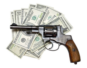Old revolver handgun lying on one hundred dollar bills with transparent background