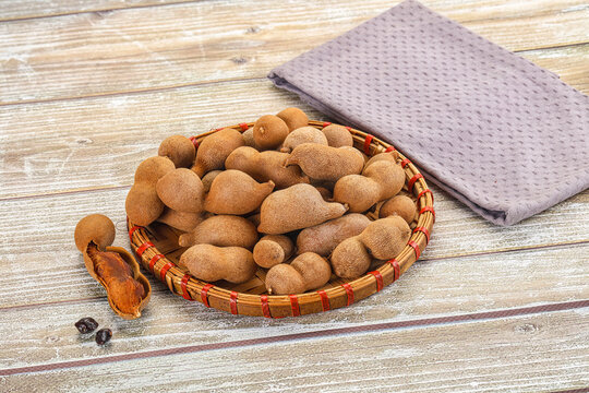 Tropical exotic Tamarind fruit heap