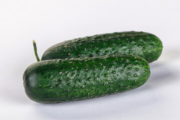 Ripe green raw two cucumbers