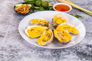 Baked oyster with cheddar cheese