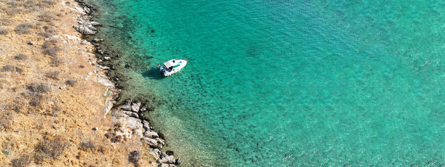 Obraz premium Aerial drone ultra wide photo of tropical exotic bay with crystal clear turquoise sea in paradise Mediterranean island
