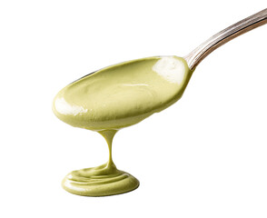 Light-yellow sauce drips from a spoon