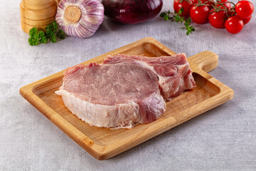 Raw pork steak with bone
