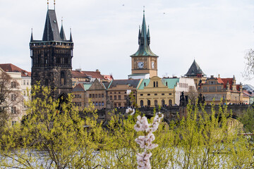 Prague, Czech Republic - April 5, 2025: View of the Charles Bridge and the Vltava River with ships passing by