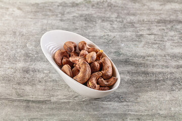 Unpeeled cashew nuts in the bowl