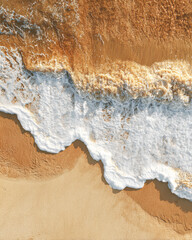 Aerial view of gentle waves lapping onto a sandy beach, showcasing the contrasting textures of foam and shoreline.