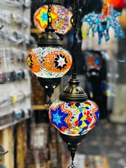 Close-up of vibrant Turkish lights, showcasing intricate patterns and rich colors. Perfect for festive, decorative, or cultural design projects and digital artwork.