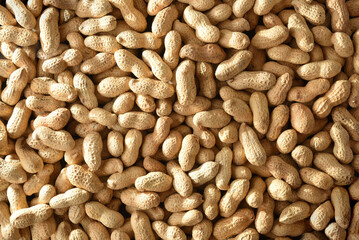 Background of a pile of peanuts in shell top view