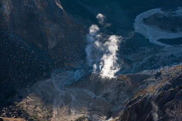 Geothermal Area With Steaming Earth In Rugged Mountainous Terrain