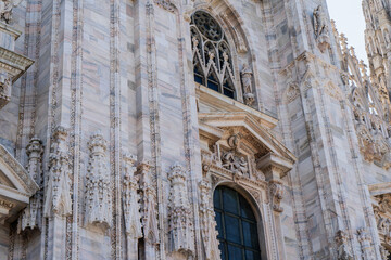 Duomo di Milano square in Milan city. Gothic Italian architecture. Italy. Sculptures and statues...