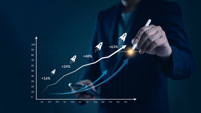 ROI, analytics Manager visualizes monthly KPI line in a workspace to optimize sales, revenue, and performance, informing business metrics and investors. concept data driven growth strategy.