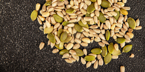 Seed mix sunflower seeds and pumpkin seeds natural product tasty snack fresh delicious gourmet food background on the table rustic top view copy space keto and paleo diet vegan and vegan food