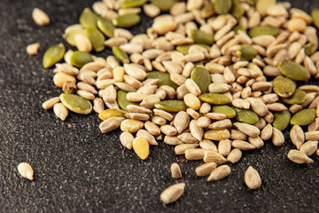 Seed mix sunflower seeds and pumpkin seeds natural product tasty snack fresh delicious gourmet food background on the table rustic top view copy space keto and paleo diet vegan and vegan food