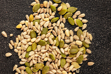 Seed mix sunflower seeds and pumpkin seeds natural product tasty snack fresh delicious gourmet food background on the table rustic top view copy space keto and paleo diet vegan and vegan food