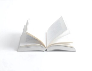 An open book rests on a plain white surface, showcasing its blank pages in a simple and elegant display.