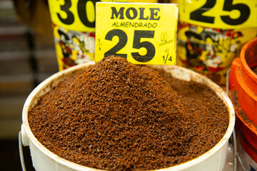 Stall selling varieties of fresh mole at the San Juan Market in Mexico City.