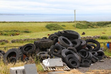 Pile of old tyres used in agriculture (for example as weight for foil or agrotextile) in County...