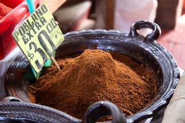 Stall selling varieties of fresh mole at the San Juan Market in Mexico City.