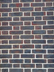 Full frame dark brick wall background with copy space
