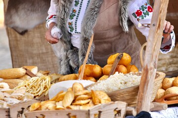 Traditional Polish Czech smoked cheese oscypek served at a folk market, grilled and displayed in baskets, authentic mountain delicacy and regional culinary heritage.