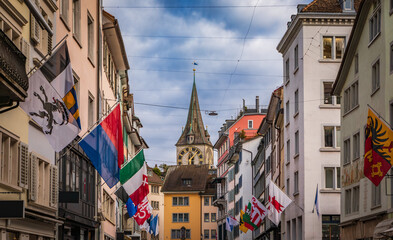 Naklejka premium St Peter Church tower from Rennweg decorated with flags, Zurich, Switzerland