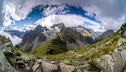 Panoramic vista of rugged alpine peaks, lush valleys, and dramatic cloudscape, showcasing a majestic mountain range.