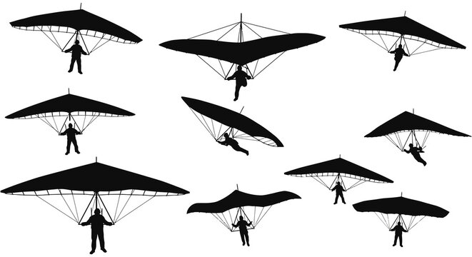 paragliders soaring high in sky with silhouette