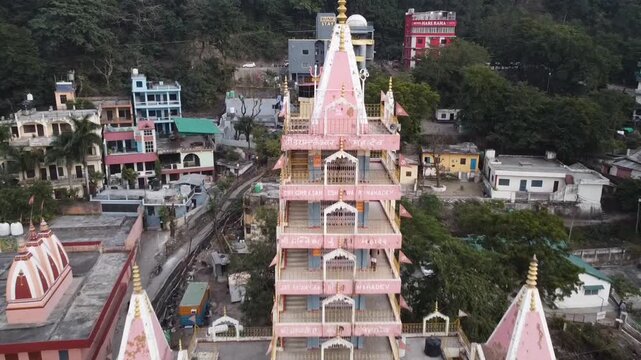 Rishikesh, Uttrakhand, India - October 10th 2024 - ​Trayambakeshwar Temple, also known as the Tera Manzil Temple. A vibrant architectural wonder on the banks of the Ganges River.