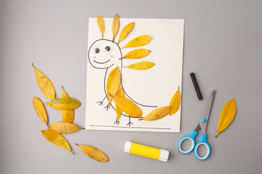 creative mix of nature and fantasy with yellow leaves forming imaginative creature perfect for children books, eco-friendly packaging, educational content, and craft-related branding,