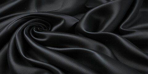 Close-up of Draped Black Satin Fabric. A close-up view of luxurious black satin fabric with dramatic folds and drapes.	
