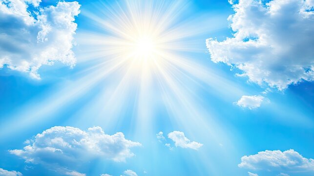 Sunlight beams through white clouds in blue sky