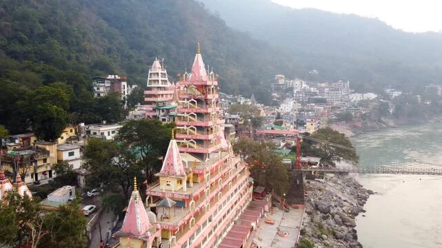 Rishikesh, Uttrakhand, India - October 10th 2024 - ​Trayambakeshwar Temple, also known as the Tera Manzil Temple. A vibrant architectural wonder on the banks of the Ganges River.