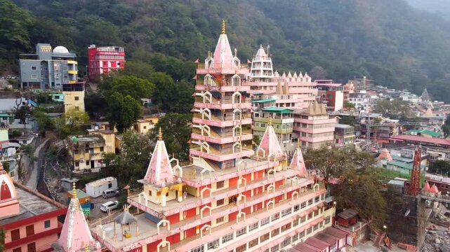 Rishikesh, Uttrakhand, India - October 10th 2024 - ​Trayambakeshwar Temple, also known as the Tera Manzil Temple. A vibrant architectural wonder on the banks of the Ganges River.