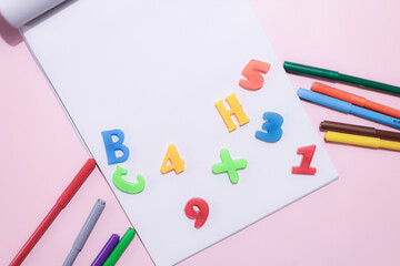 School supplies on a colorful background. Back to school background. Brushes, watercolors, pencils, ballpoint pens