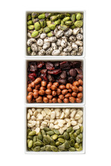 A healthy mix of nuts and dried fruit, including almonds, cashews, pistachios, cranberries, and pumpkin seeds, isolated on transparent background