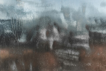 Emulsion or oil paint with an abstract pattern on a dark dirty metal texture, background