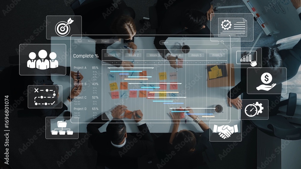 Poster a top-down view of a business meeting with professionals discussing project management tools, data v
