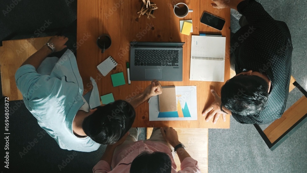 Aufkleber top view of skilled business team looking at laptop while clapping hand and putting hand together hi