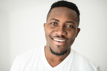 Fototapeta premium Black men wearing white shirt in studio shot on white background
