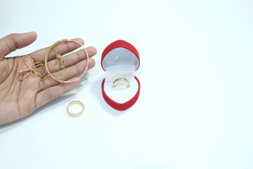 Beautiful gold jewelry. Gold jewelry on a white background.