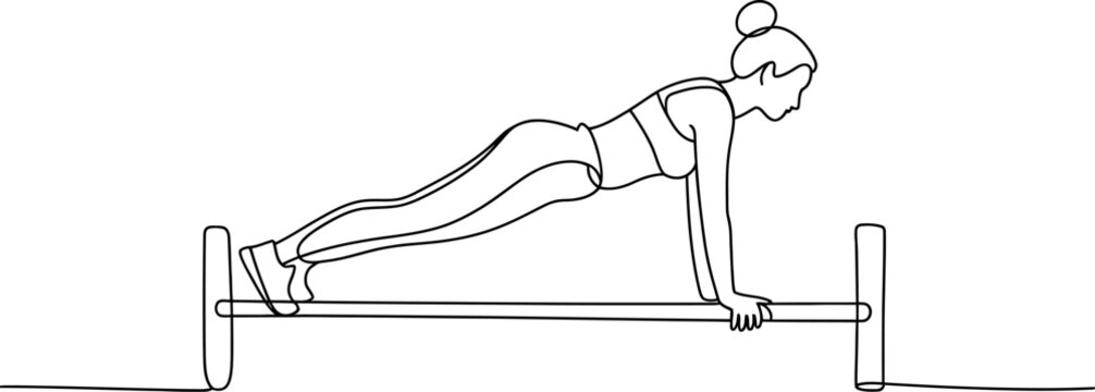 Fit woman in sportswear performing a plank exercise on parallel bars for core strength.